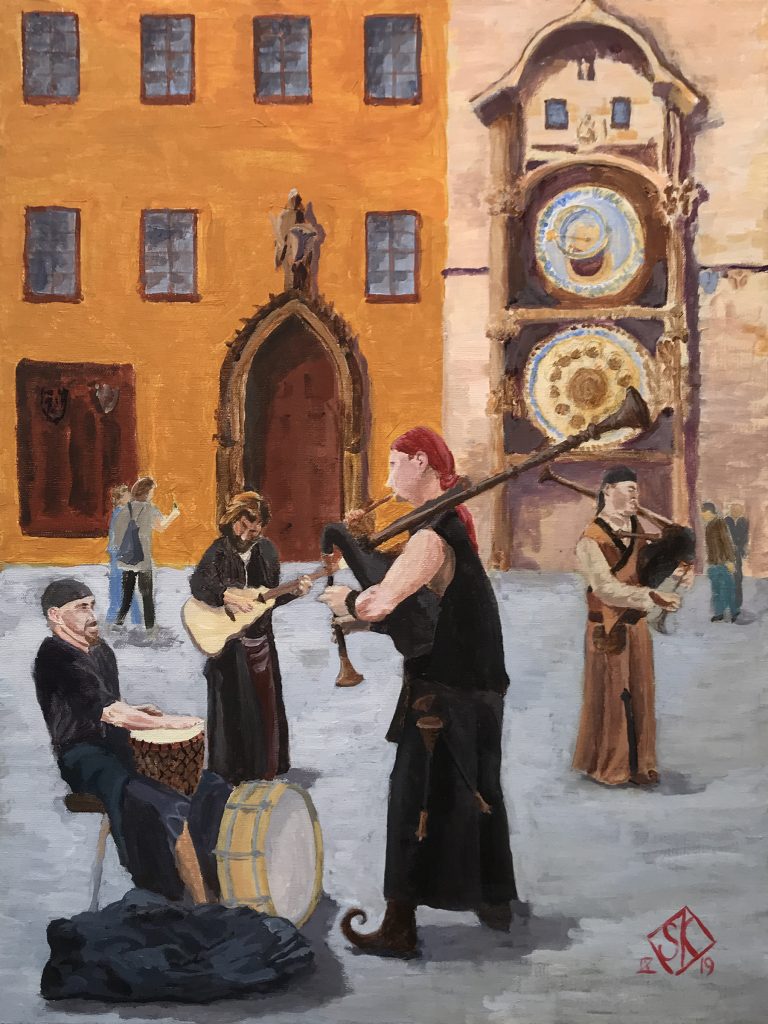 A troupe of buskers playing unusual instruments in Prague's Old Town Square