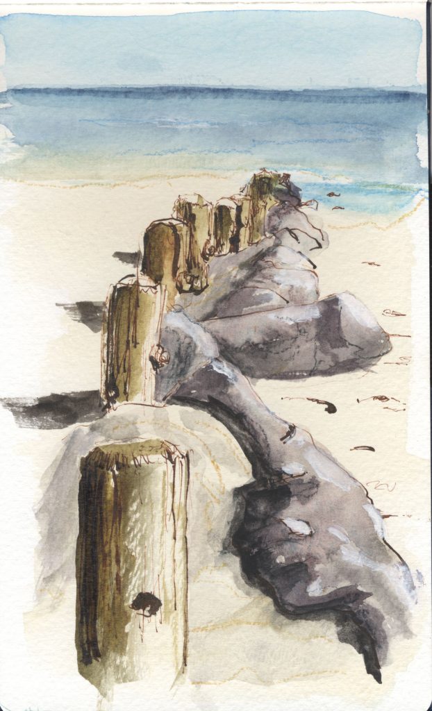 Ink and wash of a section of beach. A breakwater made of pilings and boulders